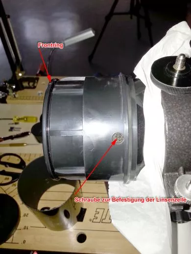 Refractors without adjustment screws and where the lens cell is attached to the tube with screws can be adjusted by tilting the lens cell towards the tube.