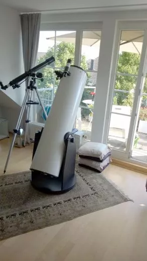 Size comparison of a 12 Dobsonian to a 70/900 refractor on an EQ mount and extended tripod.