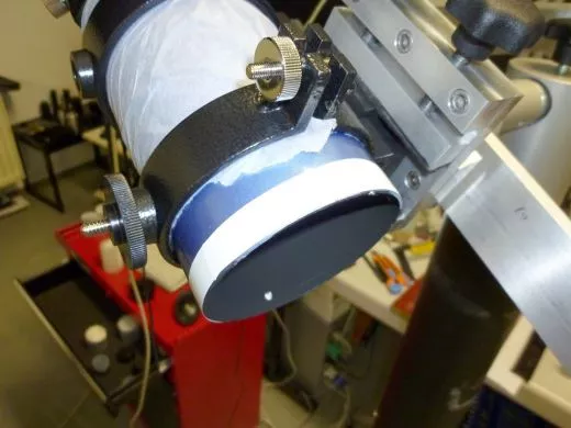 Teflon tape between lens cell and tube permanent collimation