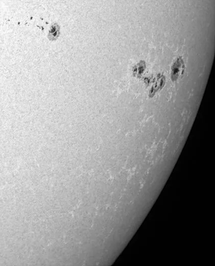 Light bridges, flare areas and sunspots on the edge of the sun