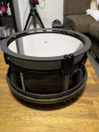 Move the primary mirror towards the focuser to achieve focus with a camera on a Newtonian telescope.